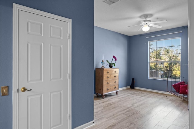 7135 Yacht Basin Ave Unit 237, Orlando, FL 32835 - sitting room featuring wood finished floors, a ceiling fan, and baseboards