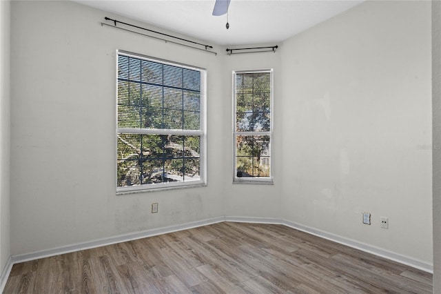 7135 Yacht Basin Ave Unit 237, Orlando, FL 32835 - empty room featuring wood finished floors, a ceiling fan, and baseboards