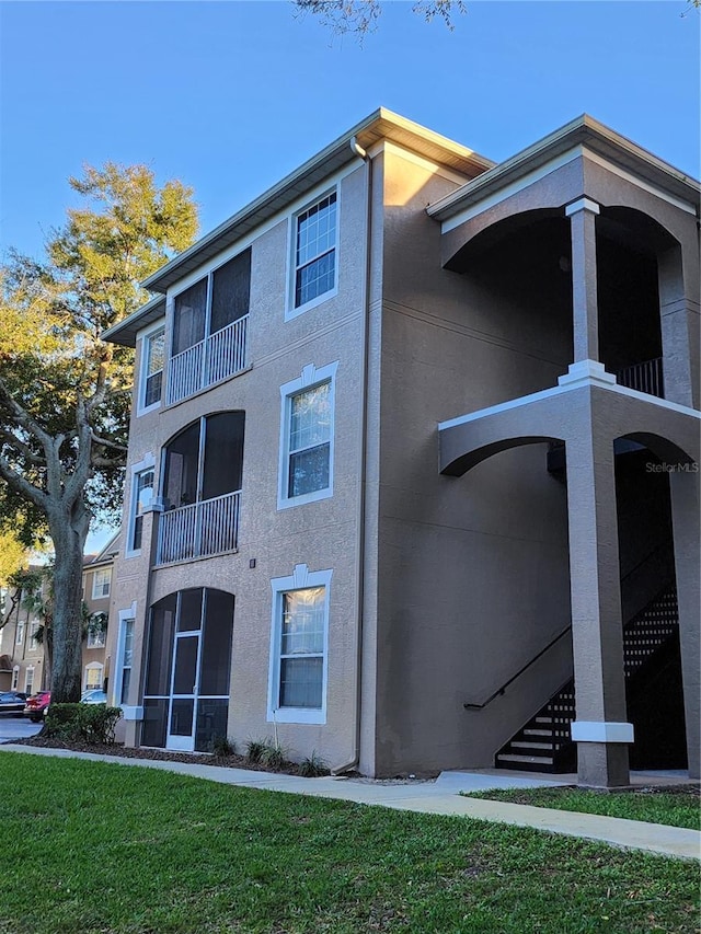 7135 Yacht Basin Ave Unit 237, Orlando, FL 32835 - view of building exterior featuring stairway