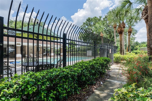 7135 Yacht Basin Ave Unit 237, Orlando, FL 32835 - gate featuring a community pool