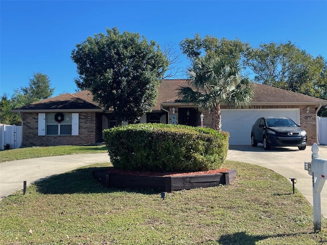 single story home featuring a front yard and a garage