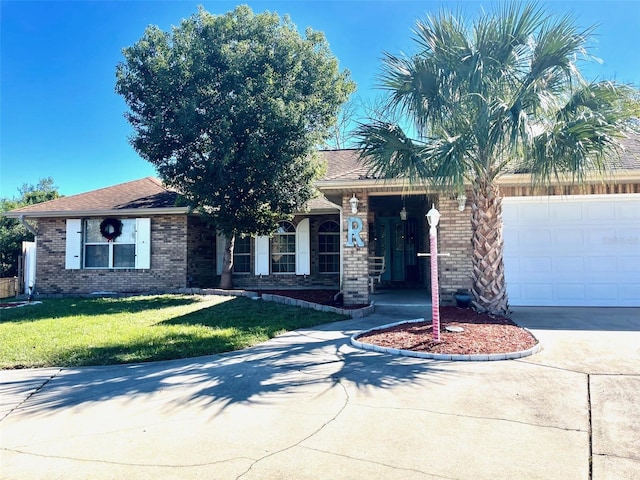 view of front of house with a garage and a front yard