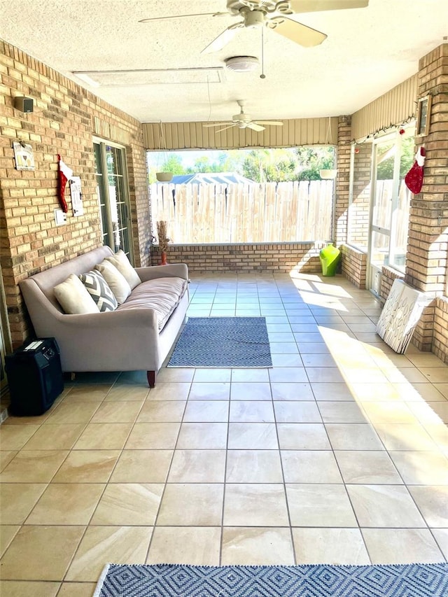 sunroom / solarium with ceiling fan