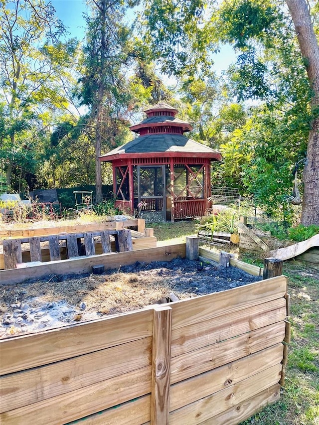 wooden terrace featuring a gazebo