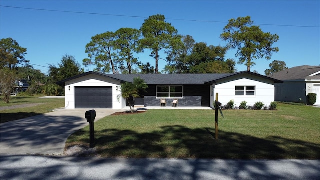 ranch-style house with a garage and a front lawn