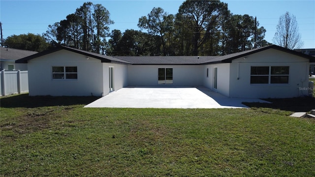 rear view of property with a patio area and a yard