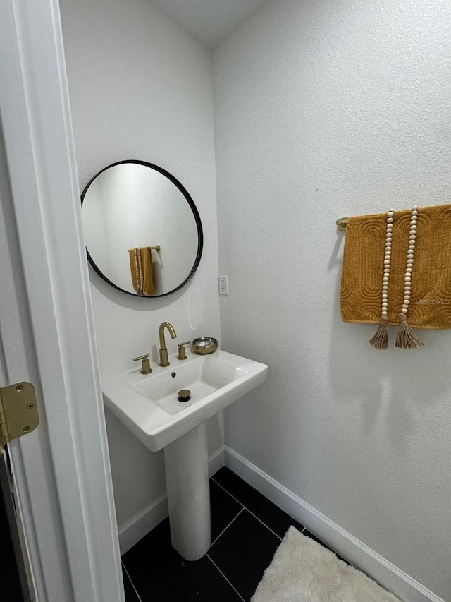 bathroom with tile patterned floors