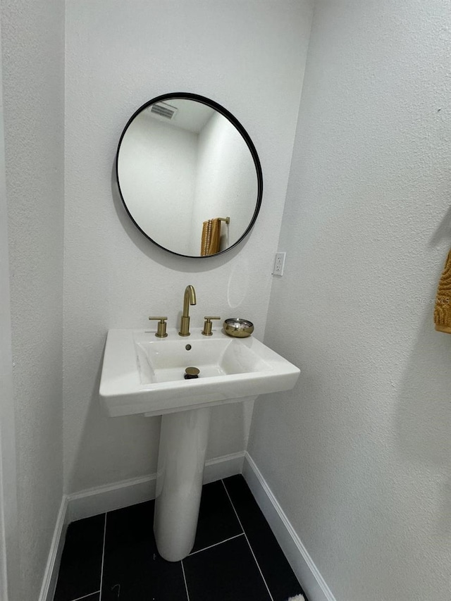 bathroom with tile patterned flooring