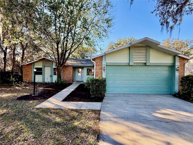 ranch-style home featuring a garage