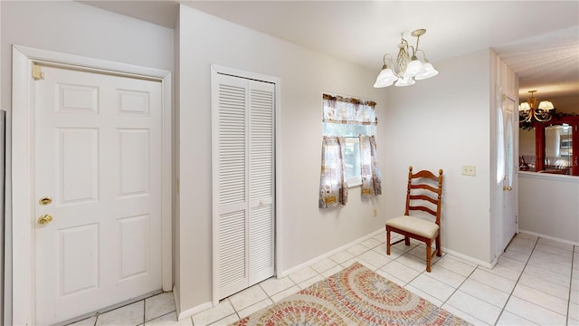 interior space featuring light tile patterned floors and a chandelier