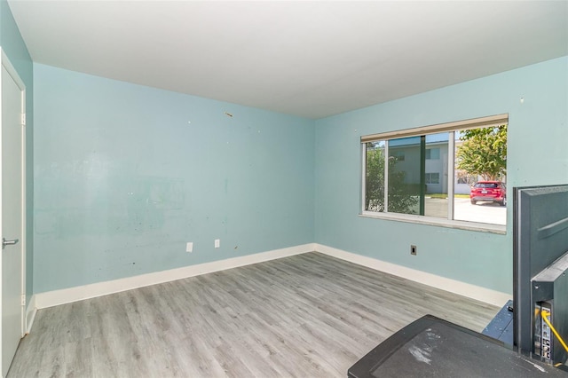 spare room with light wood-type flooring