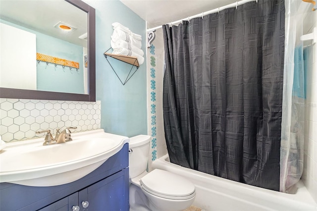 full bathroom featuring tasteful backsplash, vanity, shower / bath combo, and toilet