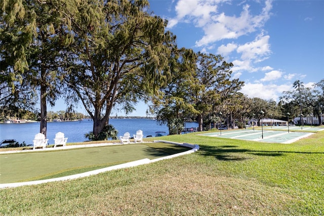 exterior space with a yard and a water view