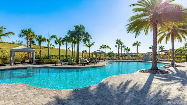 view of swimming pool featuring a gazebo and a patio area