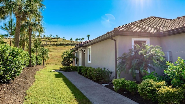 view of property exterior featuring a yard