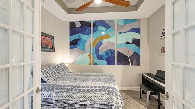 bedroom with carpet flooring, ceiling fan, and french doors