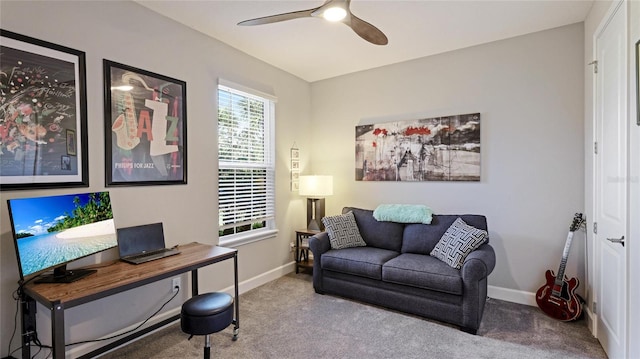 home office featuring light carpet and ceiling fan