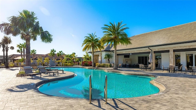 view of swimming pool featuring a patio area