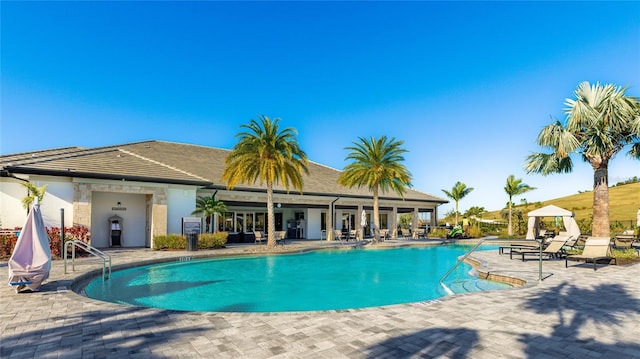 view of swimming pool with a patio