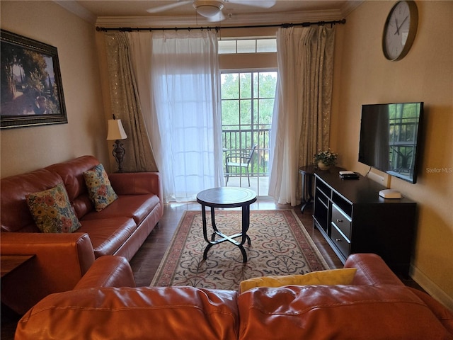 living room with ceiling fan and ornamental molding