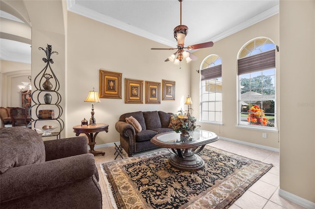 living room with ceiling fan, ornamental molding, and light tile patterned floors