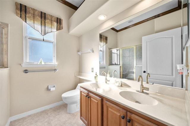 bathroom featuring vanity, crown molding, tile patterned flooring, toilet, and an enclosed shower