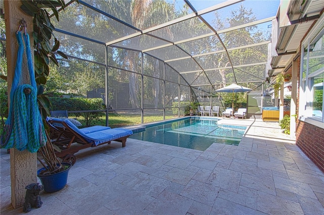 pool featuring a lanai and a patio area