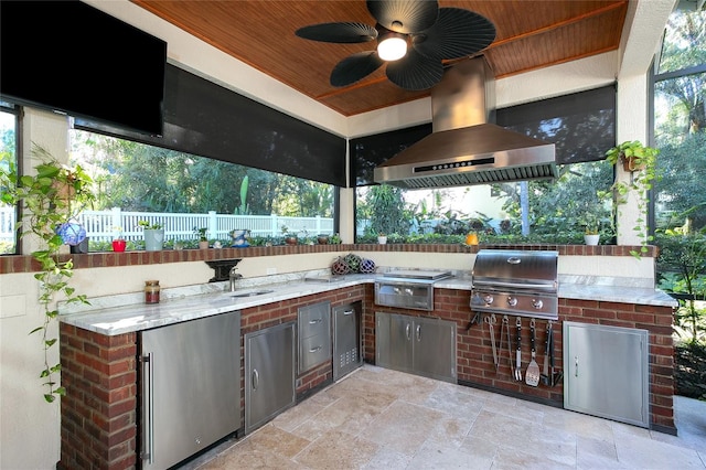 view of patio / terrace featuring a sink, an outdoor kitchen, area for grilling, and ceiling fan