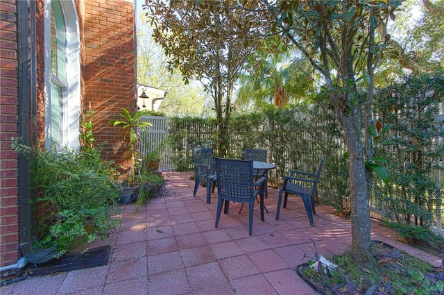 view of patio / terrace with outdoor dining area and fence