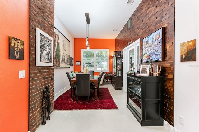 dining room with light floors and baseboards