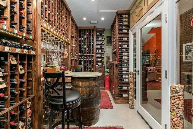 wine cellar featuring recessed lighting and tile patterned floors