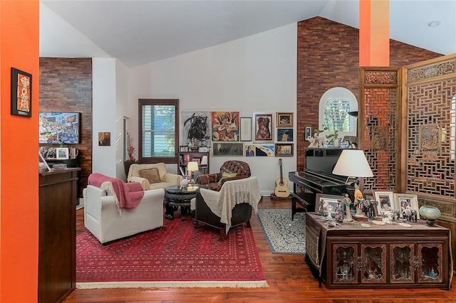 living room with high vaulted ceiling, a wealth of natural light, and wood finished floors