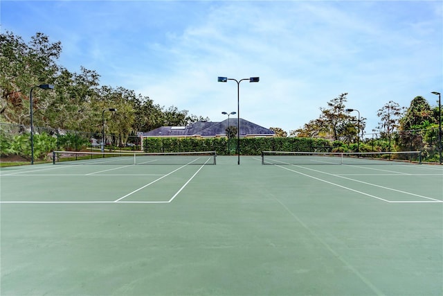 view of sport court with fence