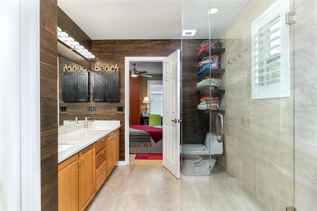 ensuite bathroom with double vanity, visible vents, toilet, connected bathroom, and a sink