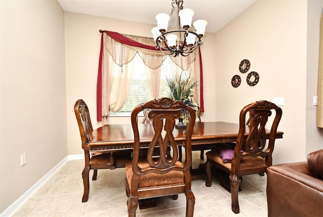 dining room with a notable chandelier