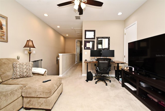 office space with light carpet and ceiling fan