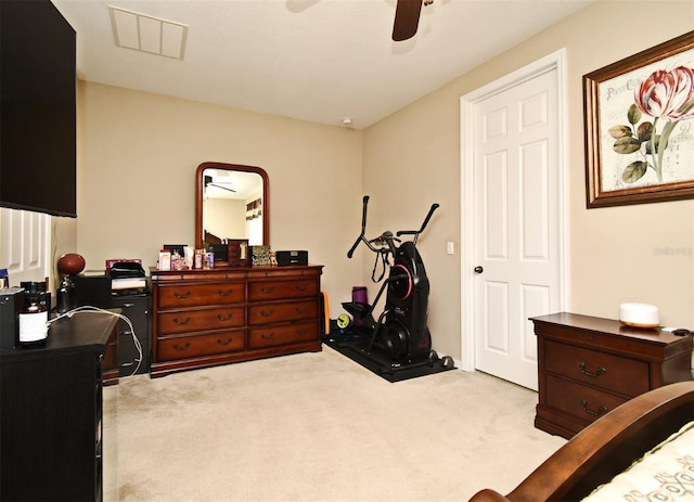 carpeted bedroom with ceiling fan