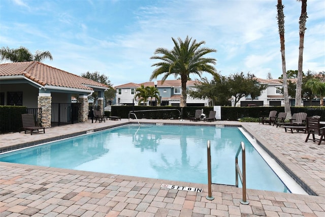 view of swimming pool with a patio area