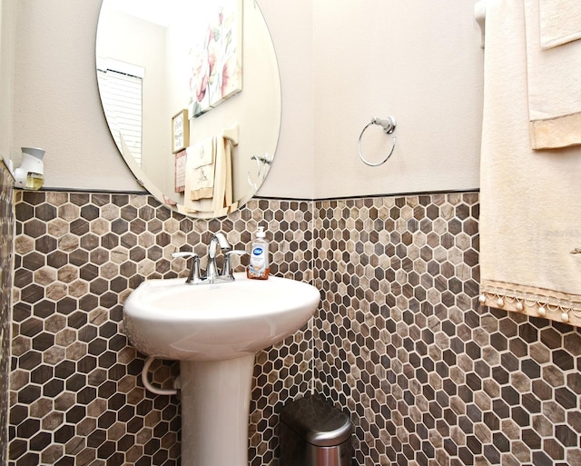 bathroom with tile walls