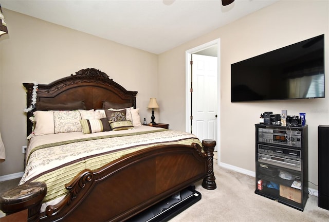 bedroom featuring ceiling fan and light colored carpet