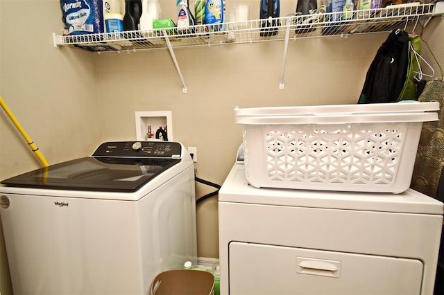 laundry area featuring washing machine and clothes dryer