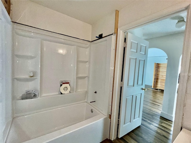 bathroom featuring hardwood / wood-style floors and shower / bath combination