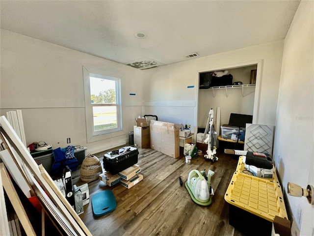 interior space with hardwood / wood-style floors and a closet