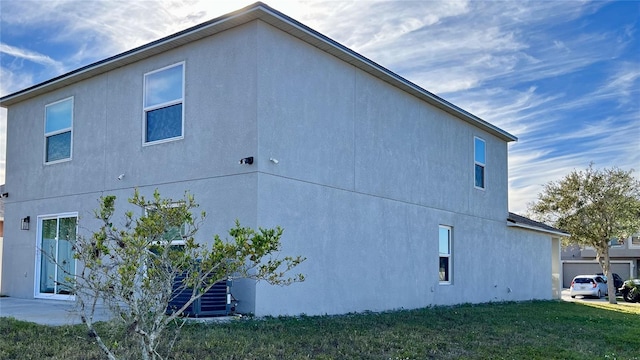 view of property exterior with a yard