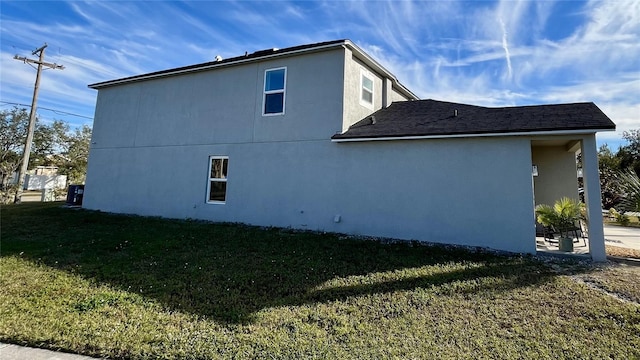 view of property exterior featuring a yard