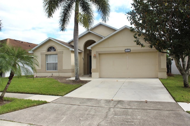 single story home featuring a front yard and a garage