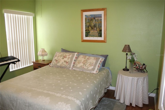 bedroom featuring dark hardwood / wood-style floors