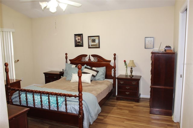 bedroom with wood-type flooring and ceiling fan