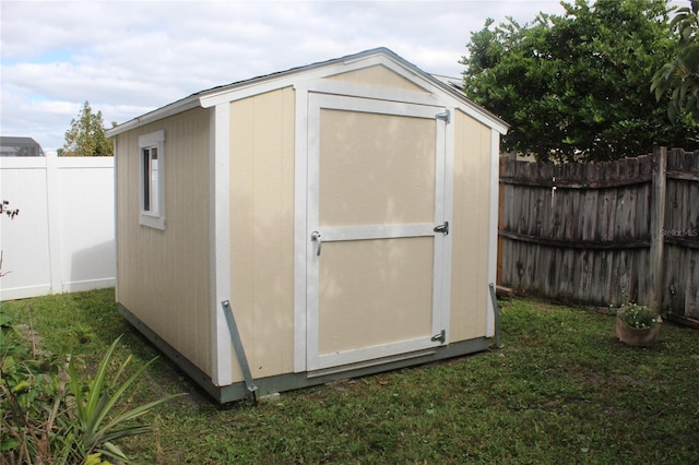 view of outdoor structure with a lawn