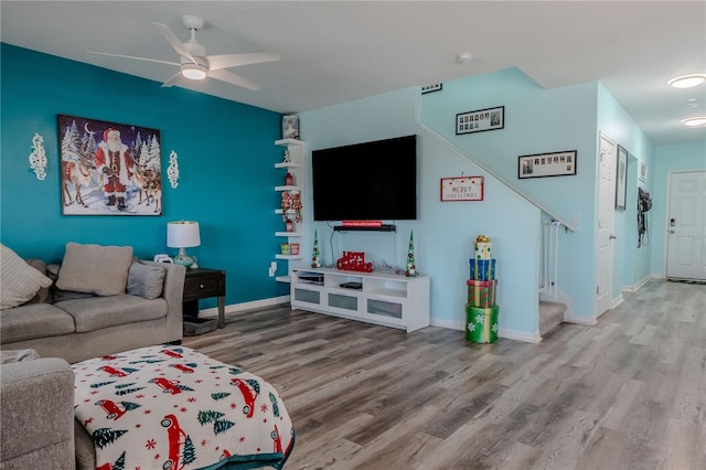 living room with ceiling fan and hardwood / wood-style floors